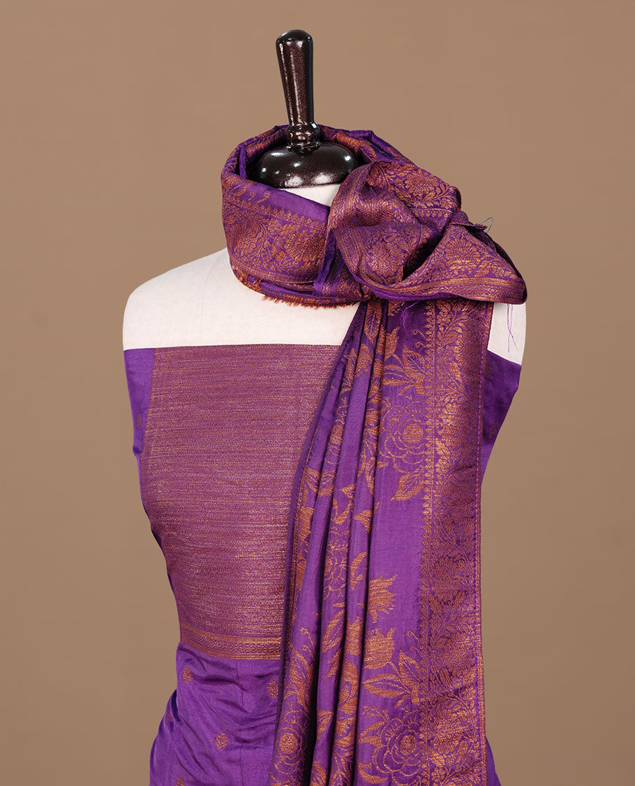 Purple colour churidhar material featuring Antique zari motifs on body, paired with matching bottom and Dupatta.