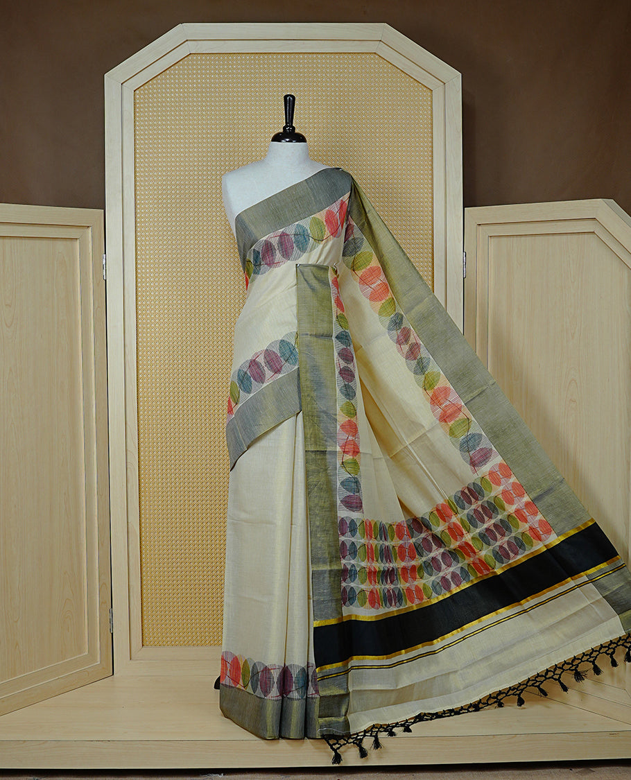 Cream Colour Tissue Kerala Saree Featuring Multicolour Circular Prints Along The Border And Pallu, Complemented By A Black Border With Traditional Gold Zari Accents, Paired With A Matching Blouse Piece.