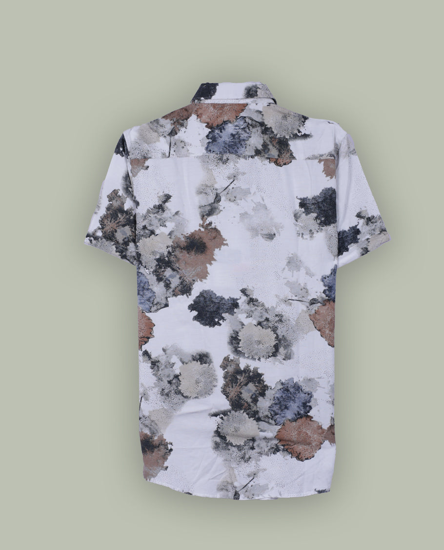 White colour short sleeve shirt features a rounded spread collar and a watercolor style floral print in brown, black, and blue & its ideal for both casual days and laid back evenings.