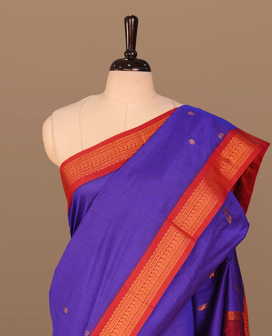 Indigo colour kalyani cotton saree featuring antique zari motifs on body, complemented by Maroon colour with Antique zari border, paired with matching blouse piece.