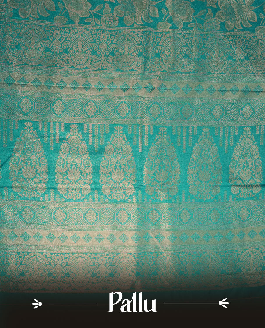 Teal green colour semi soft silk brocade saree featuring elegant self-woven floral motifs on the body, finished with an intricately detailed matching border and pallu, paired with a coordinated blouse piece.