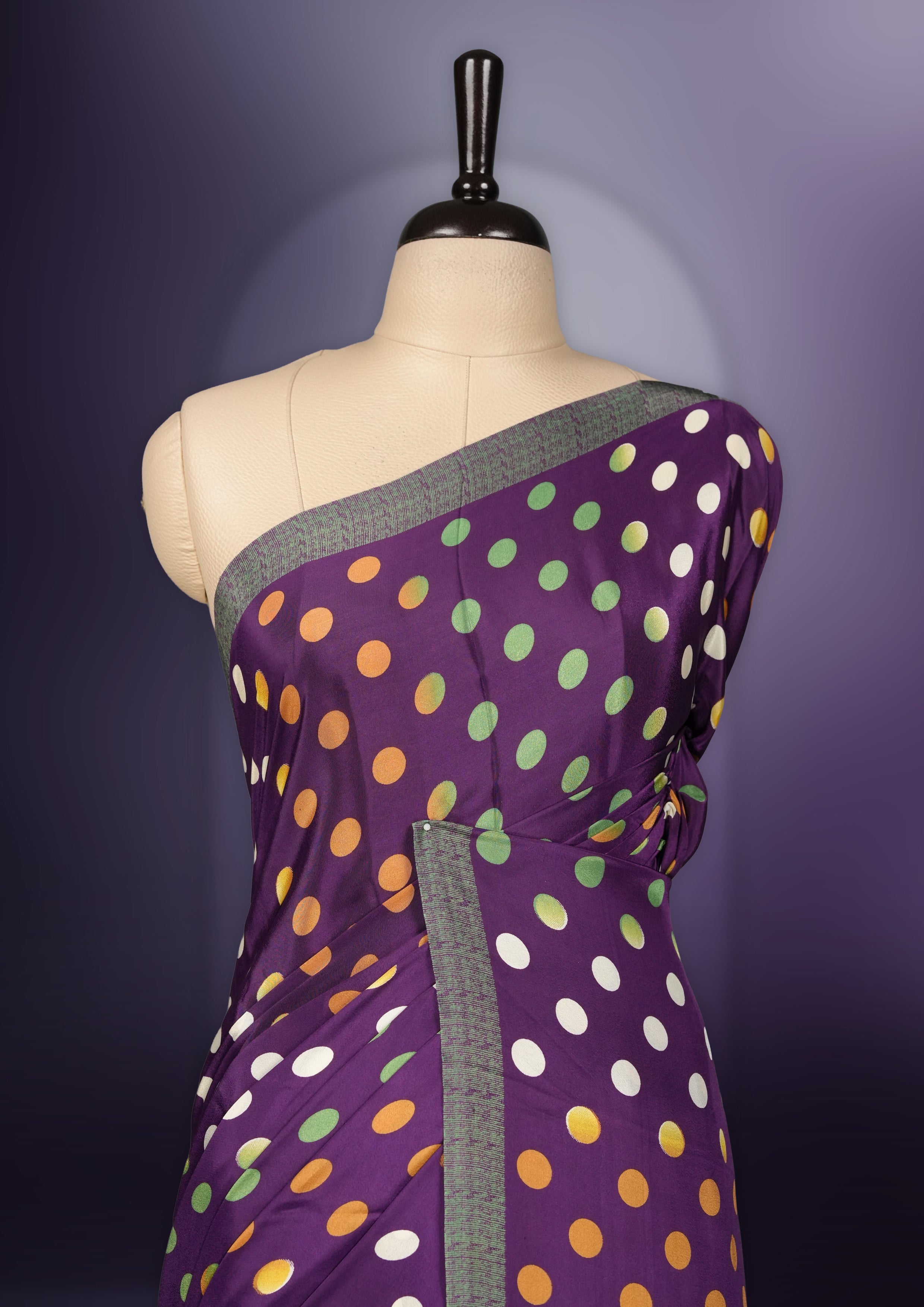 Purple colour saree with with large big polka dots on the body, self stripped pallu & Comes with a stylish matching blouse.