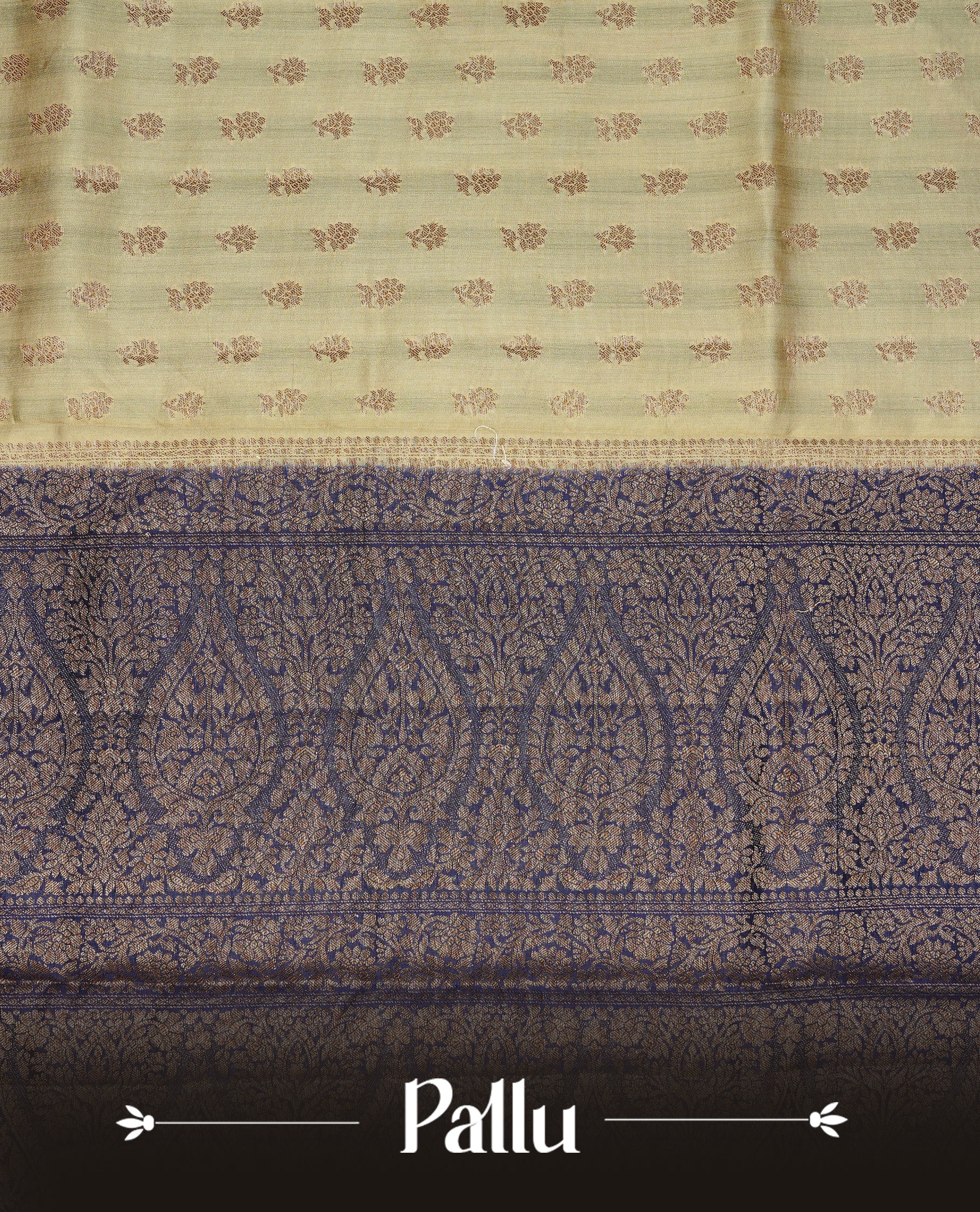 Cream colour Banaras tussar silk saree featuring elegant gold zari buttas across the body, complemented by a contrast Navy Blue border with rich zari detailing. Comes paired with a matching blouse piece.