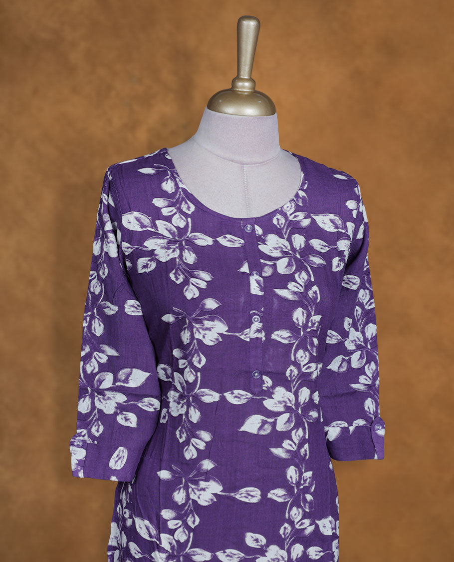 Violet colour kurti with White floral prints, knee length design, styled with a round neckline and a sleeve .