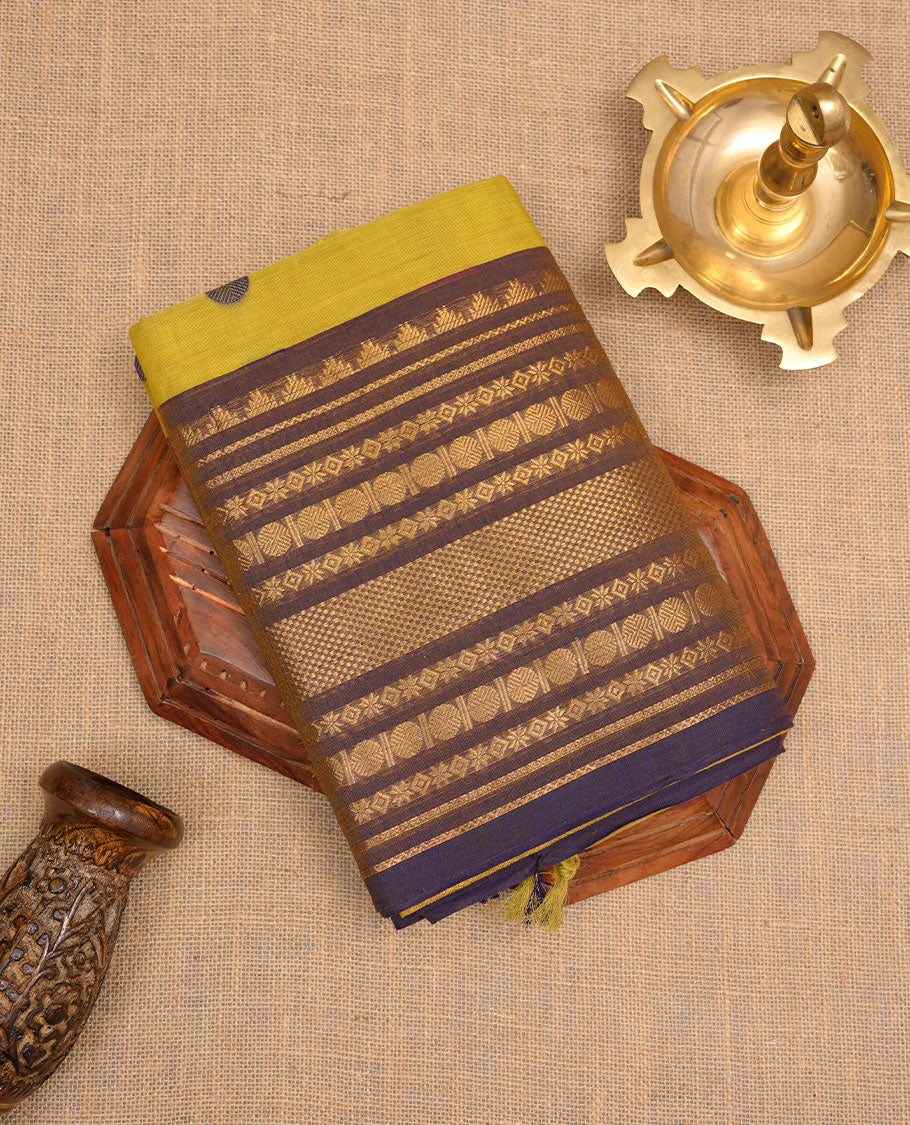 Olive colour chettinad cotton saree featuring Purple colour motifs on body, contrast purple colour border with gold zari border, pallu and paired with matching blouse.