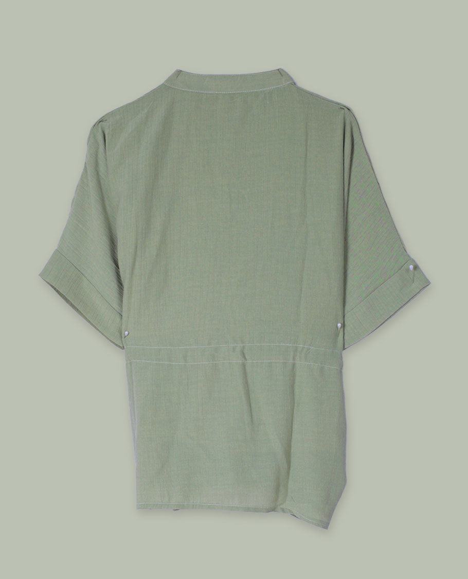 Olive green short-sleeve top with V-slit band neckline, contrast beige crochet motif on one side, and adjustable drawstring at the waist.