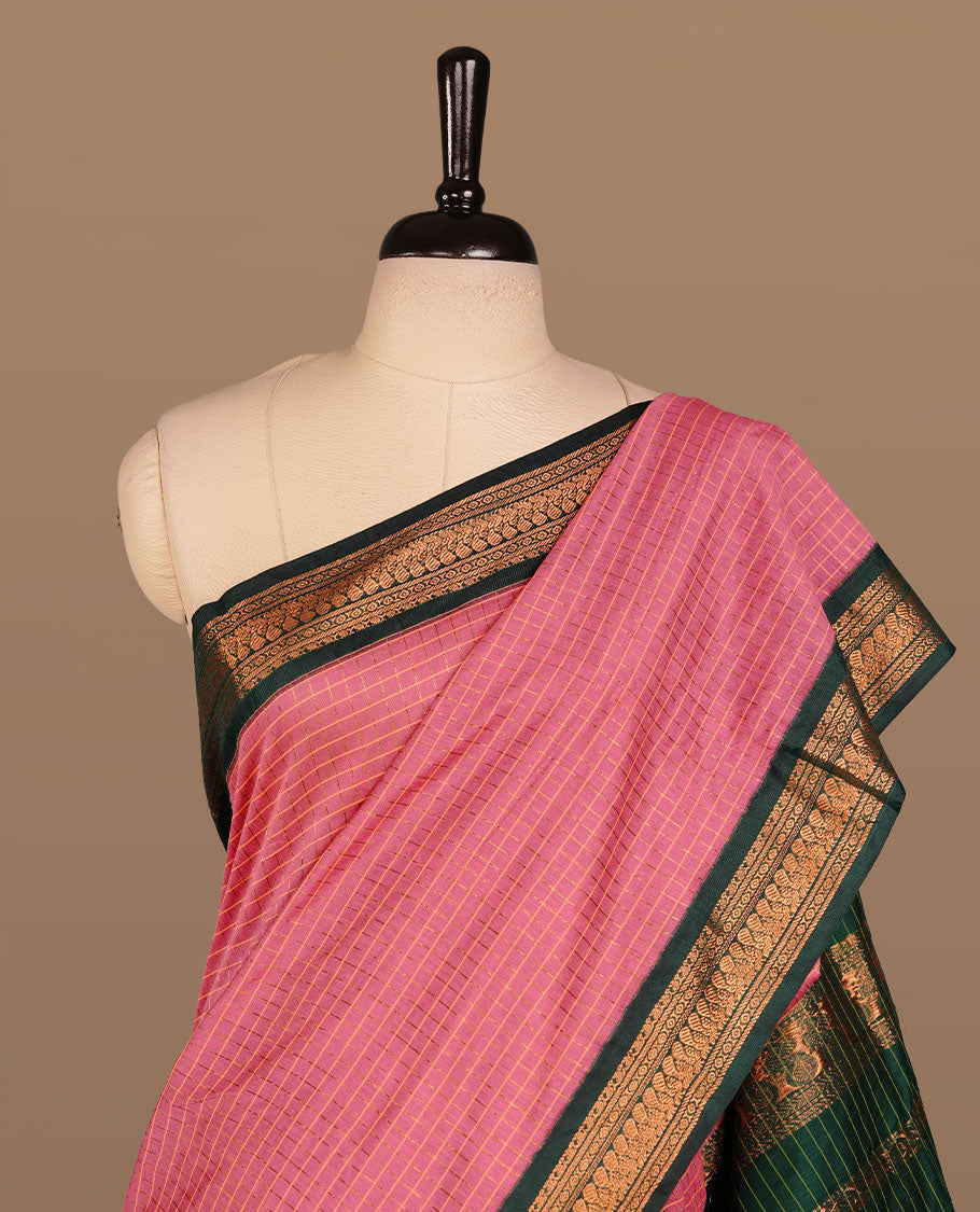 Pink colour kalyani cotton saree featuring gold zari check pattern on body, complemented by green colour with Antique zari border, paired with matching blouse piece.