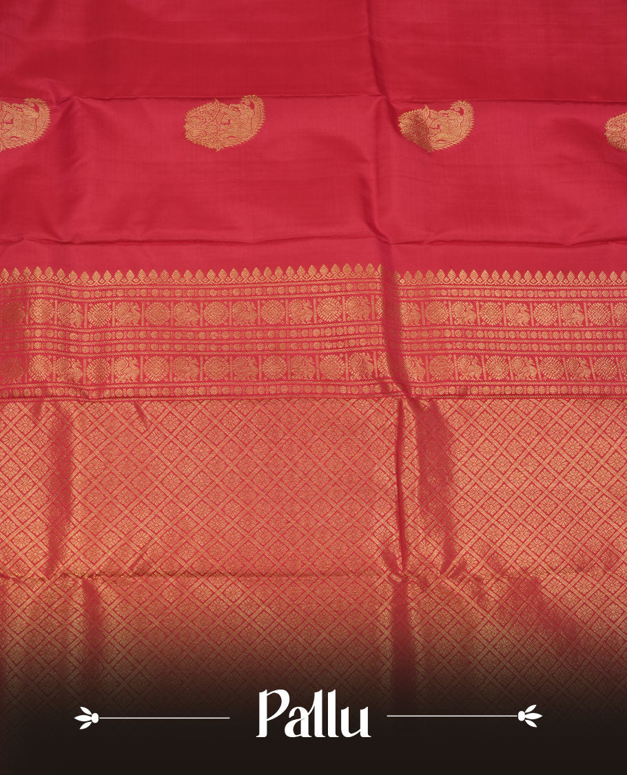 Vibrant red colour pure traditional Kancheepuram silk saree adorned with an elegant zari elephant motif on the body, complemented by a rich gold zari woven border featuring intricate traditional designs, paired with a matching blouse piece.