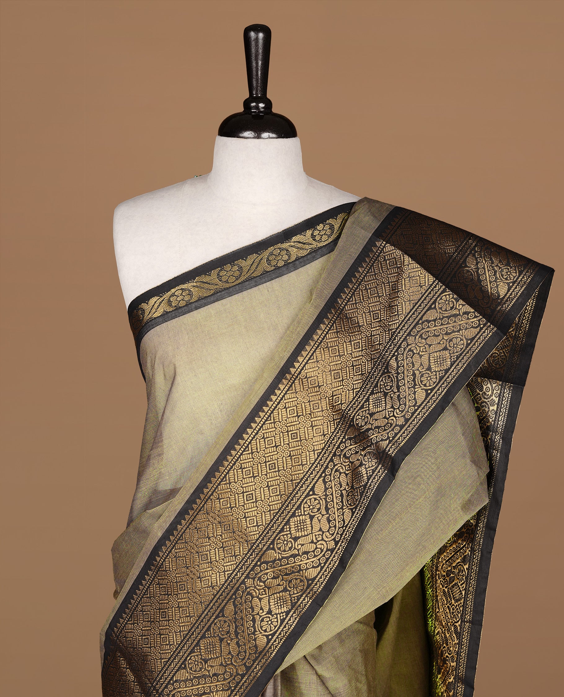 Grey Beige Colour chettinad cotton saree featuring Elegant plain body, complemented by contrast Black colour with gold zari border, paired with matching blouse.