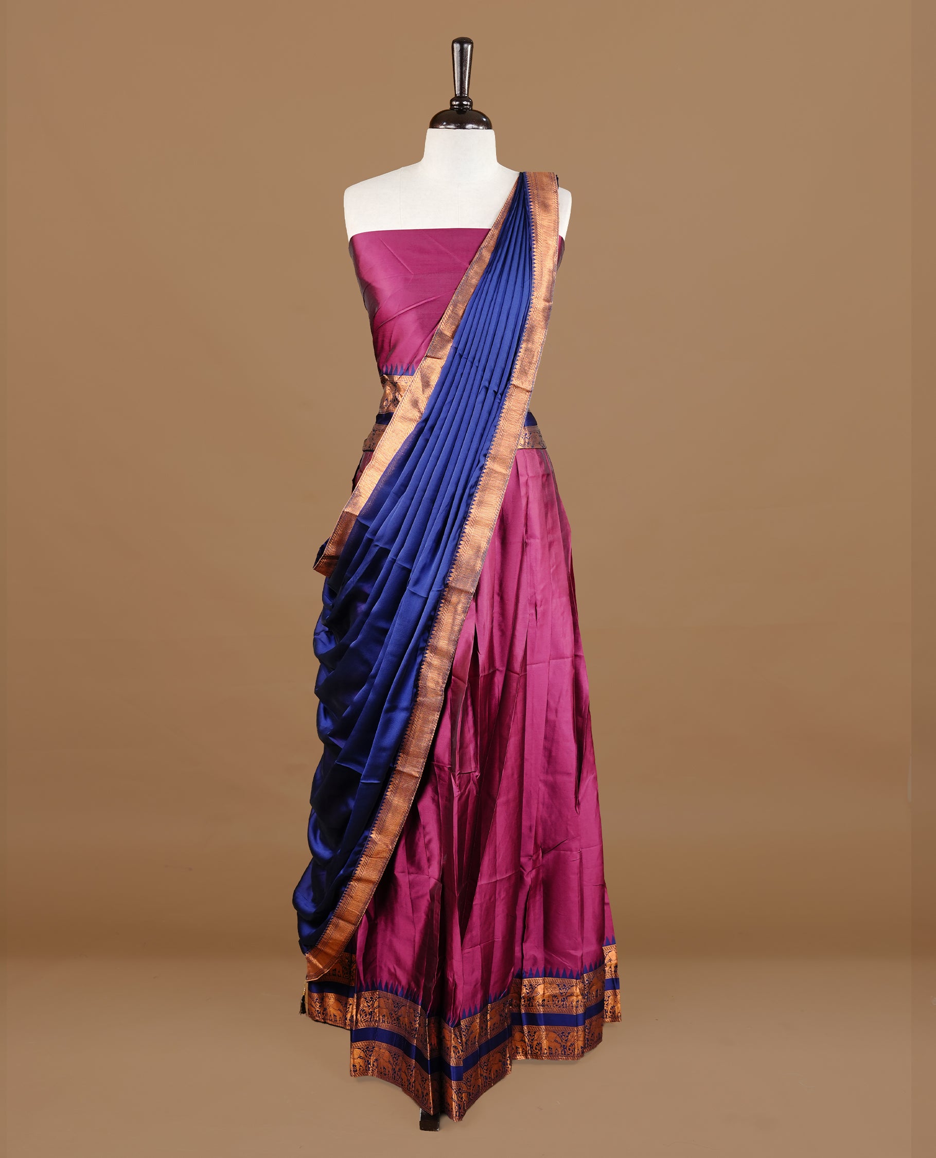 Burgundy colour semi stitched Half saree featuring contrast navy blue colour with Antique zari traditional border skirt, paired with matching zari border dupatta, unstitched blouse piece