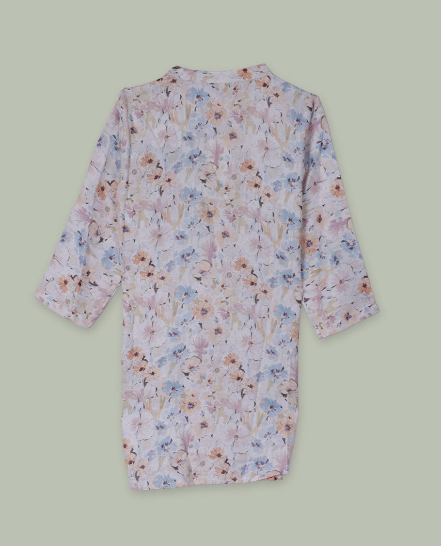 Pastel floral printed tunic top with band collar, pintuck-detailed front, half button placket, and three-quarter sleeves.