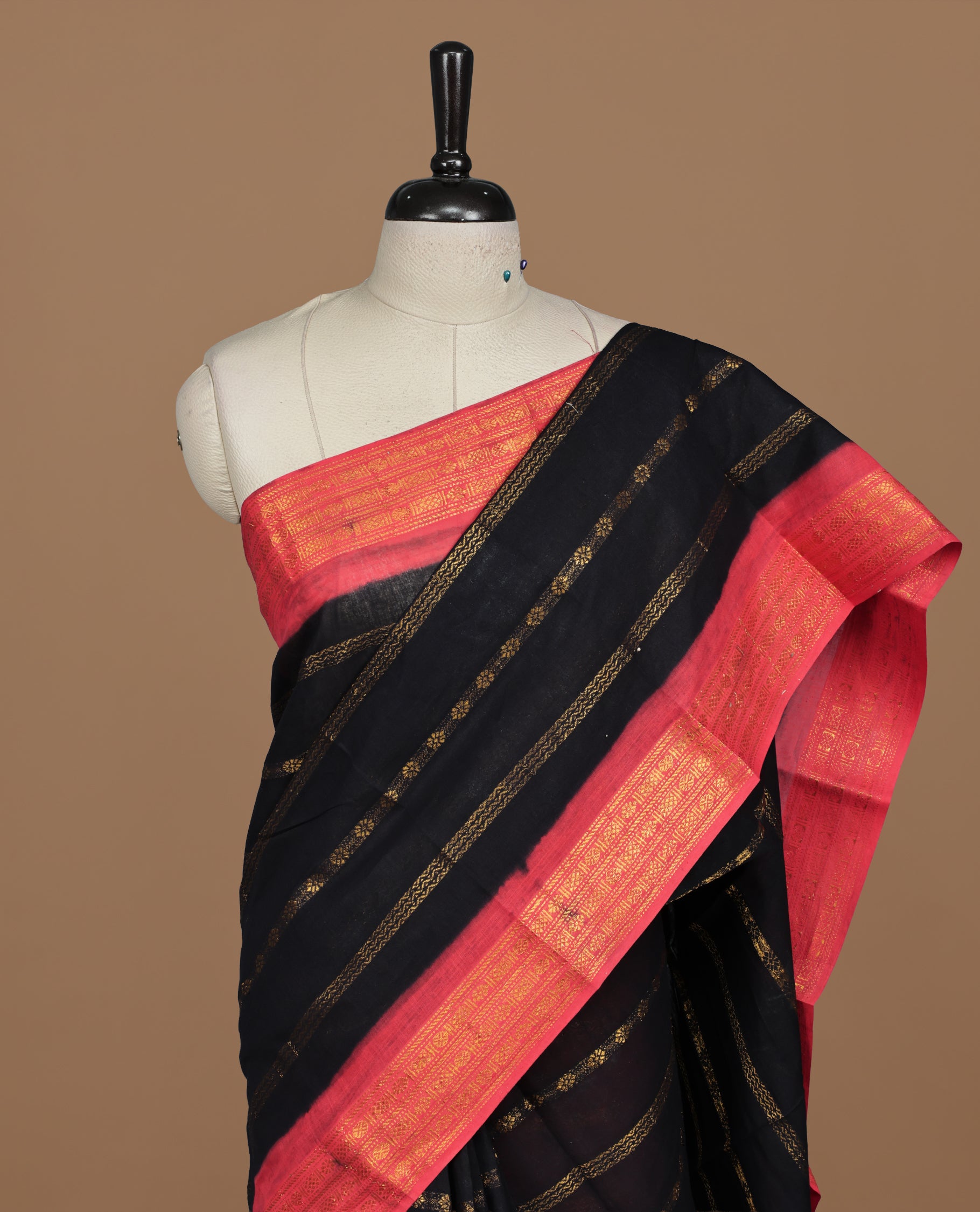 Black colour Sungudi cotton saree featuring Gold zari Stripes on body, Gold zari on Contrast red colour border, paired with matching blouse piece.