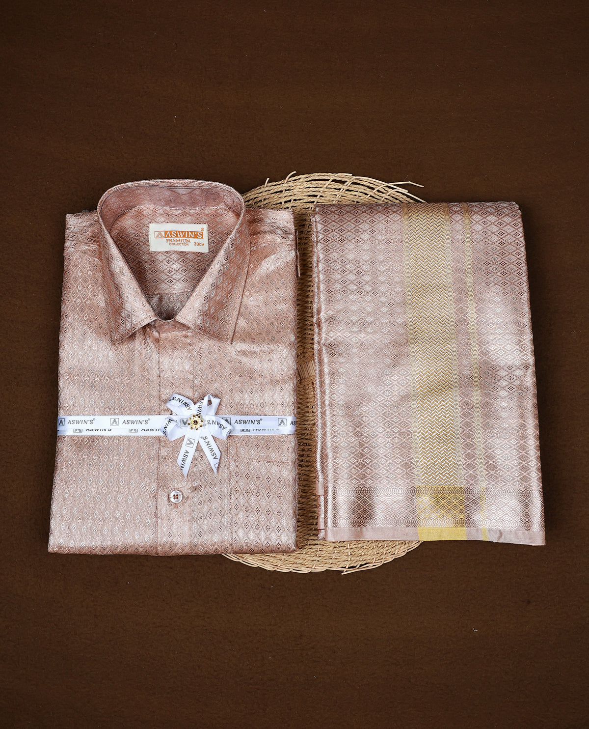 Rose Gold colour ASWIN'S shirt paired with a matching dhoti, finishing with a Gold kara