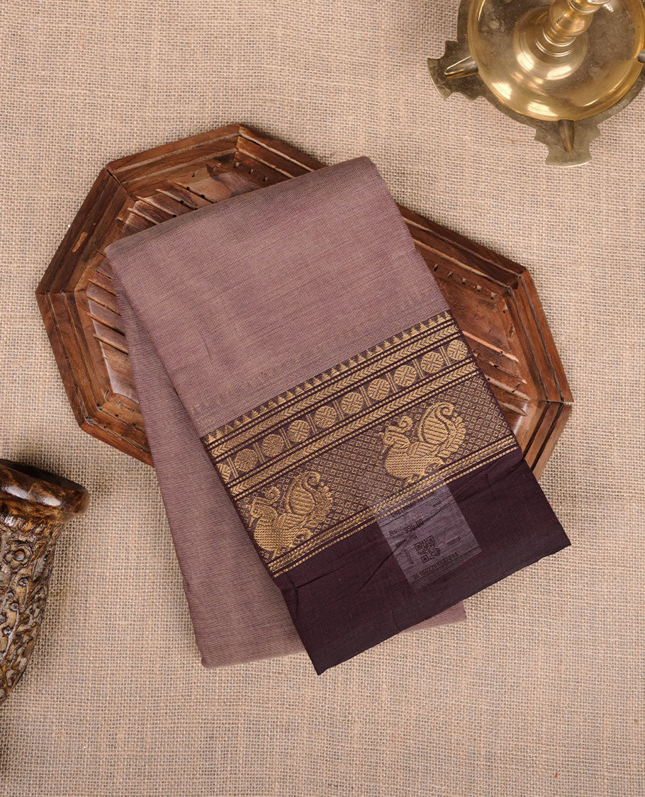 French beige colour chettinad cotton saree featuring plain body, contrast chocolate brown colour with traditional gold zari border without blouse.