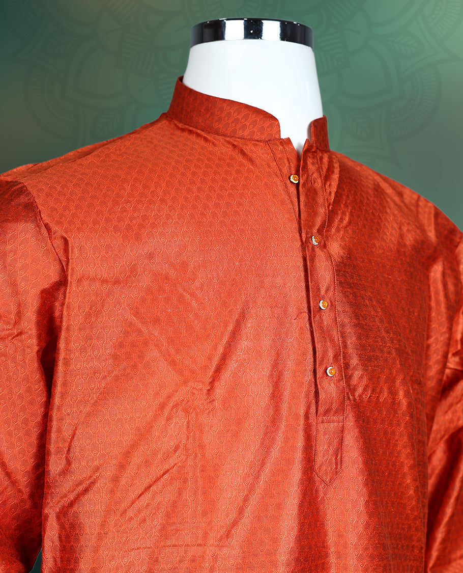 Rust orange men’s kurta crafted in a rich textured fabric, featuring a mandarin collar, full sleeves, side slits, and a buttoned placket, ideal for traditional, festive, and cultural occasions.