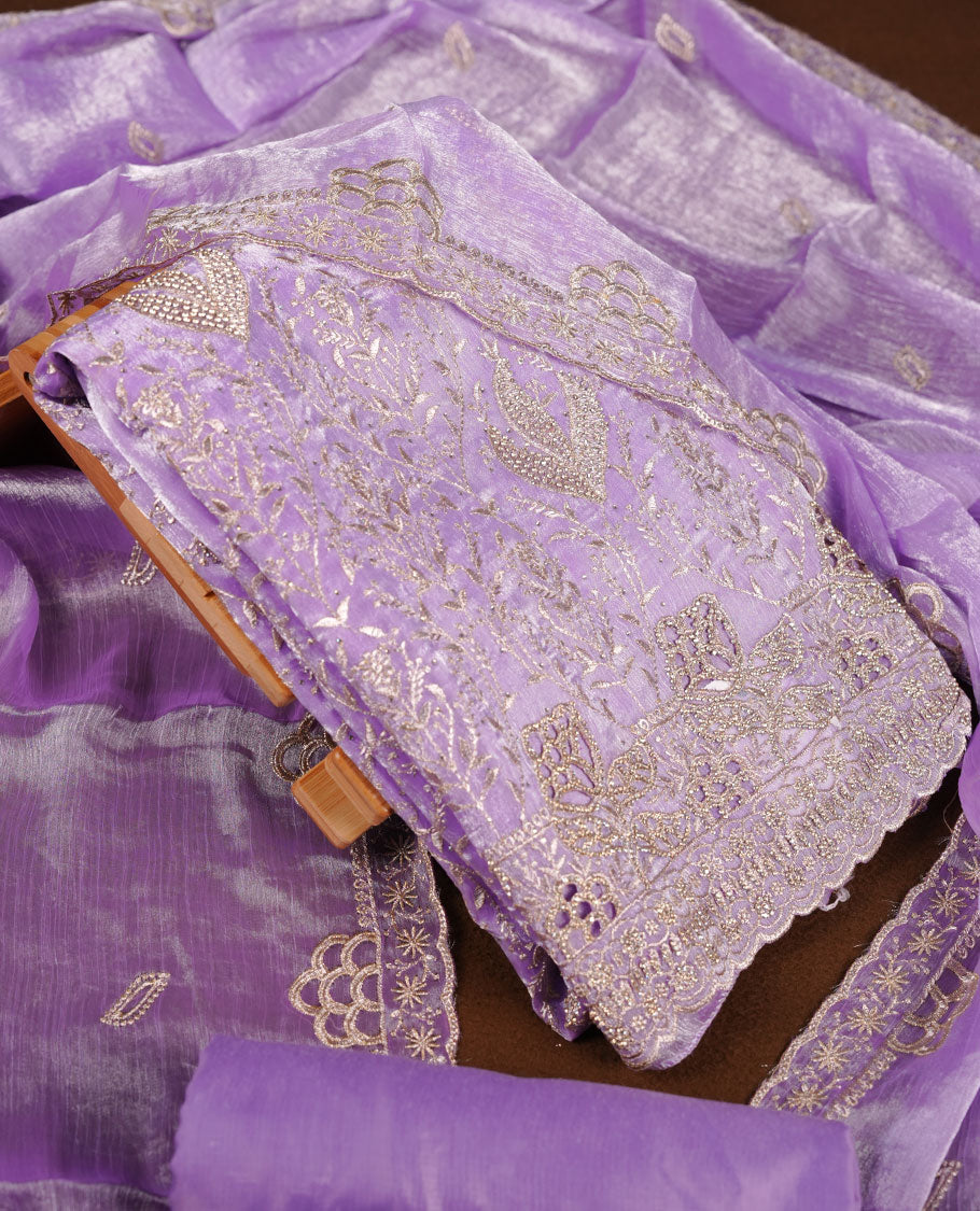 Lavender colour churidar set with stone and thread embroidery and detailing, paired with matching pant and dupatta.