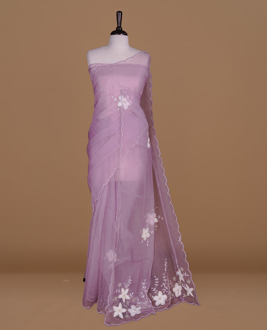 Pastel lavender colour crush organza saree featuring white floral work with beats & sequins, highlighting scalp with beats worked border, paired with matching blouse piece.