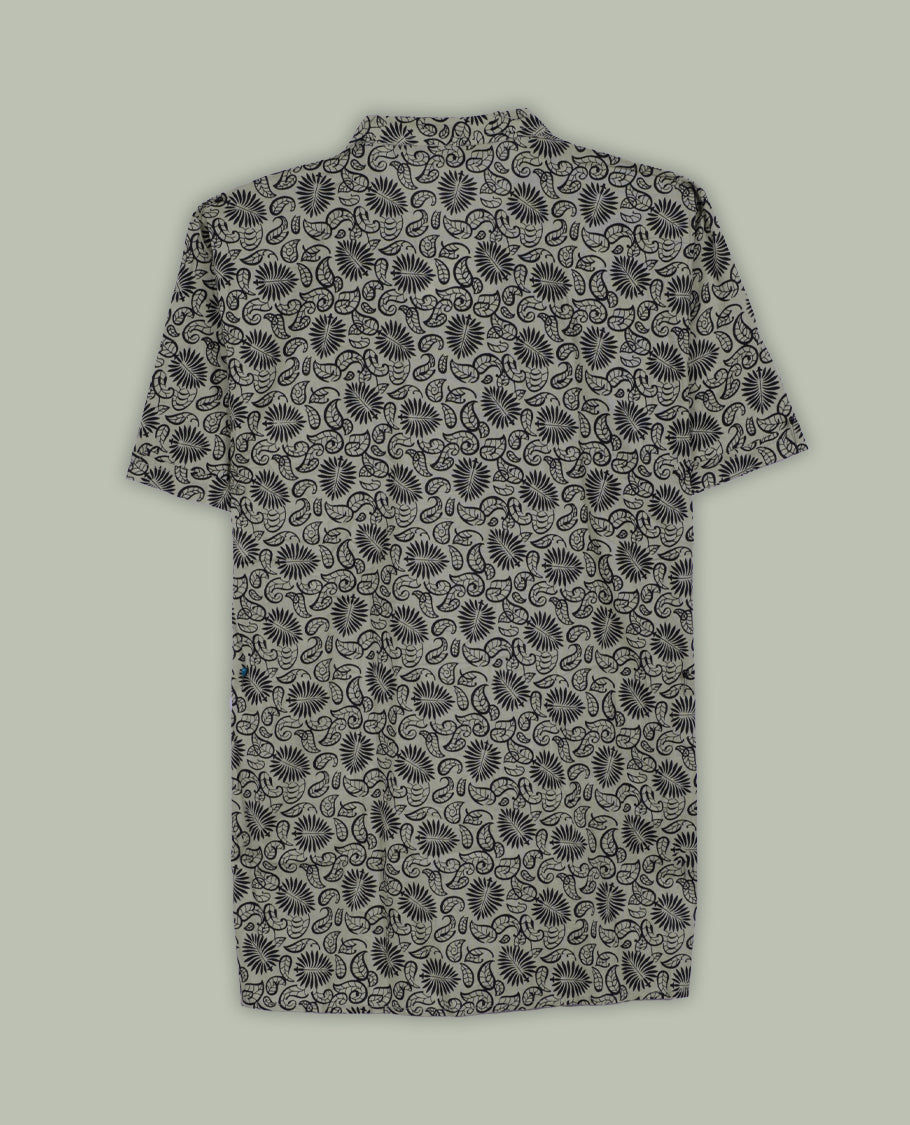 Beige colour short sleeve shirt with black floral and paisley print, featuring a classic chinese collar and wooden button half placket, A breezy and stylish pick for both relaxed days and casual evenings.