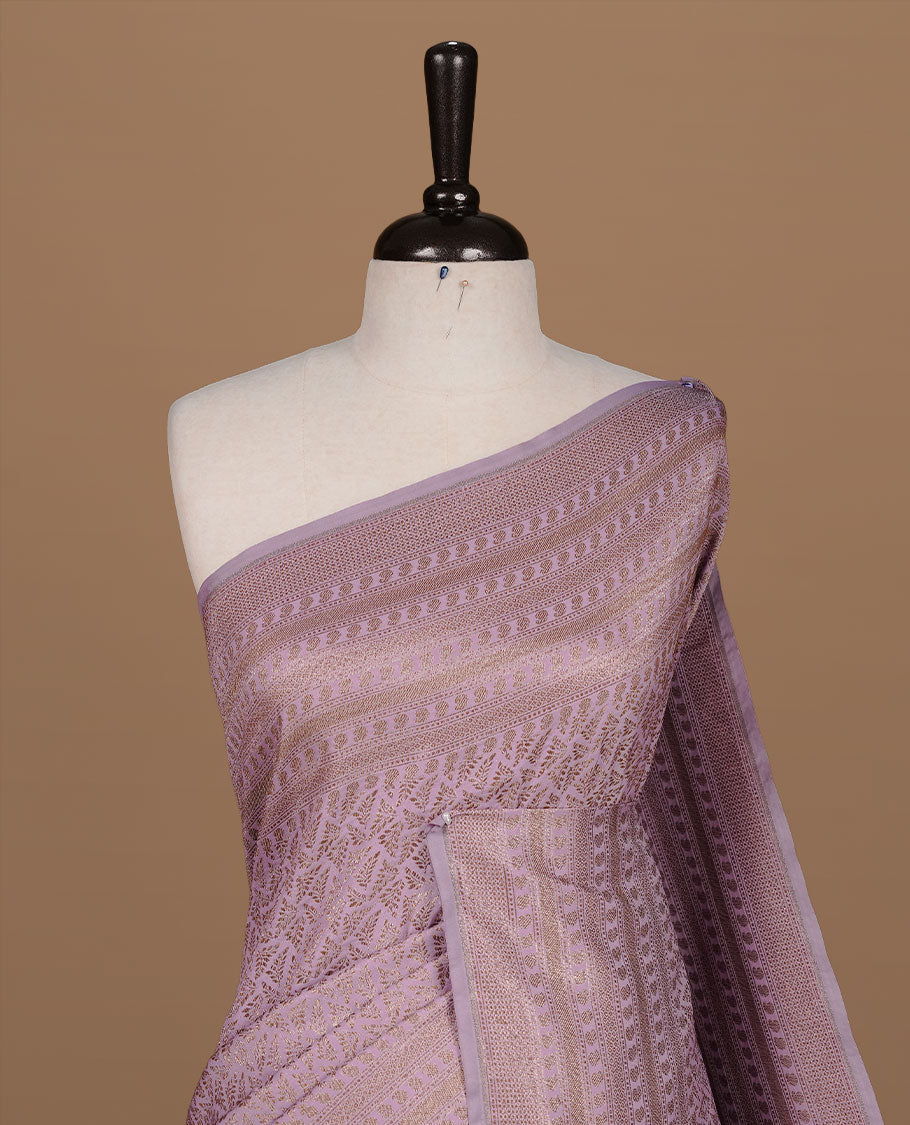 Lavender colour Semi Banaras Katan saree featuring Antique zari Floral pattern on body, complemented by self colour zari border, paired with matching blouse piece.