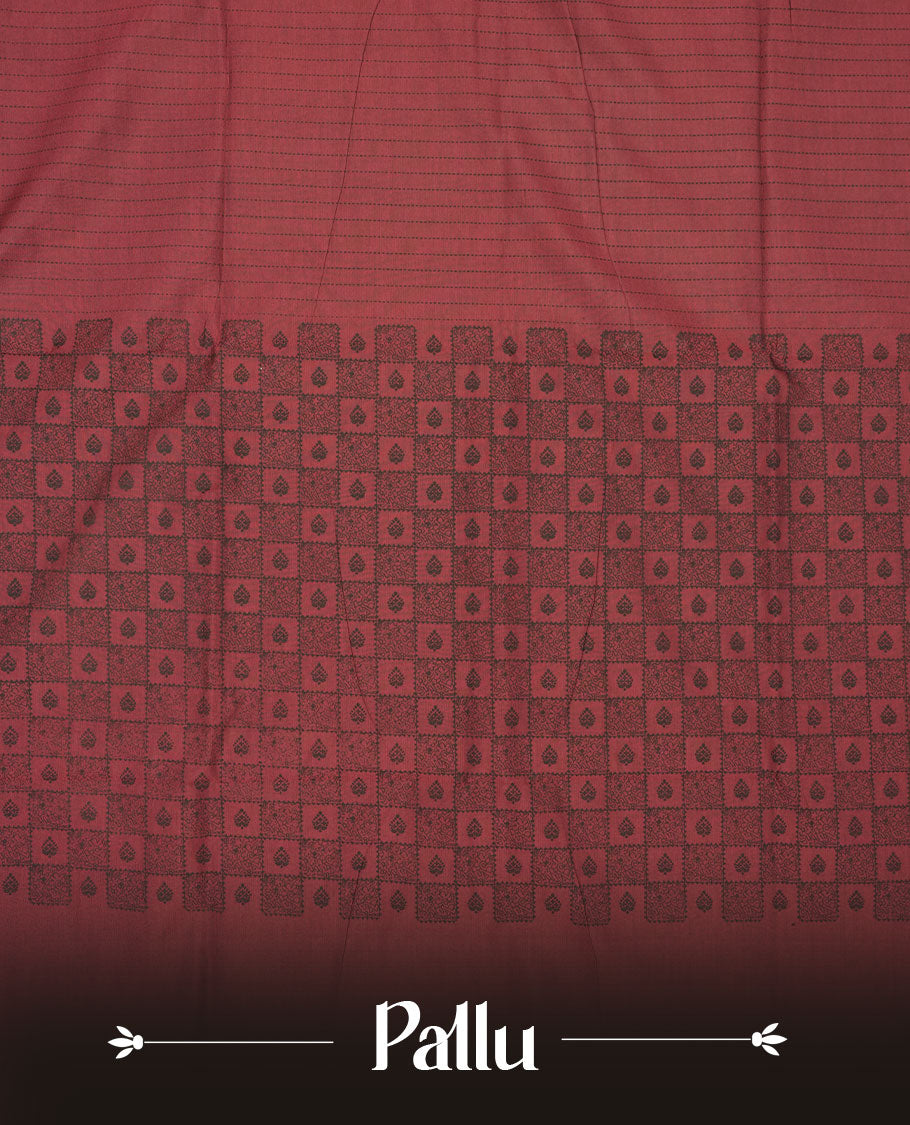 Dark Red colour poly cotton saree with black vertical dotted line pattern on the body, paired with a matching pallu featuring black zigzag geometric border, and a coordinated all‑over black stylised fleur‑de‑lis printed blouse piece.