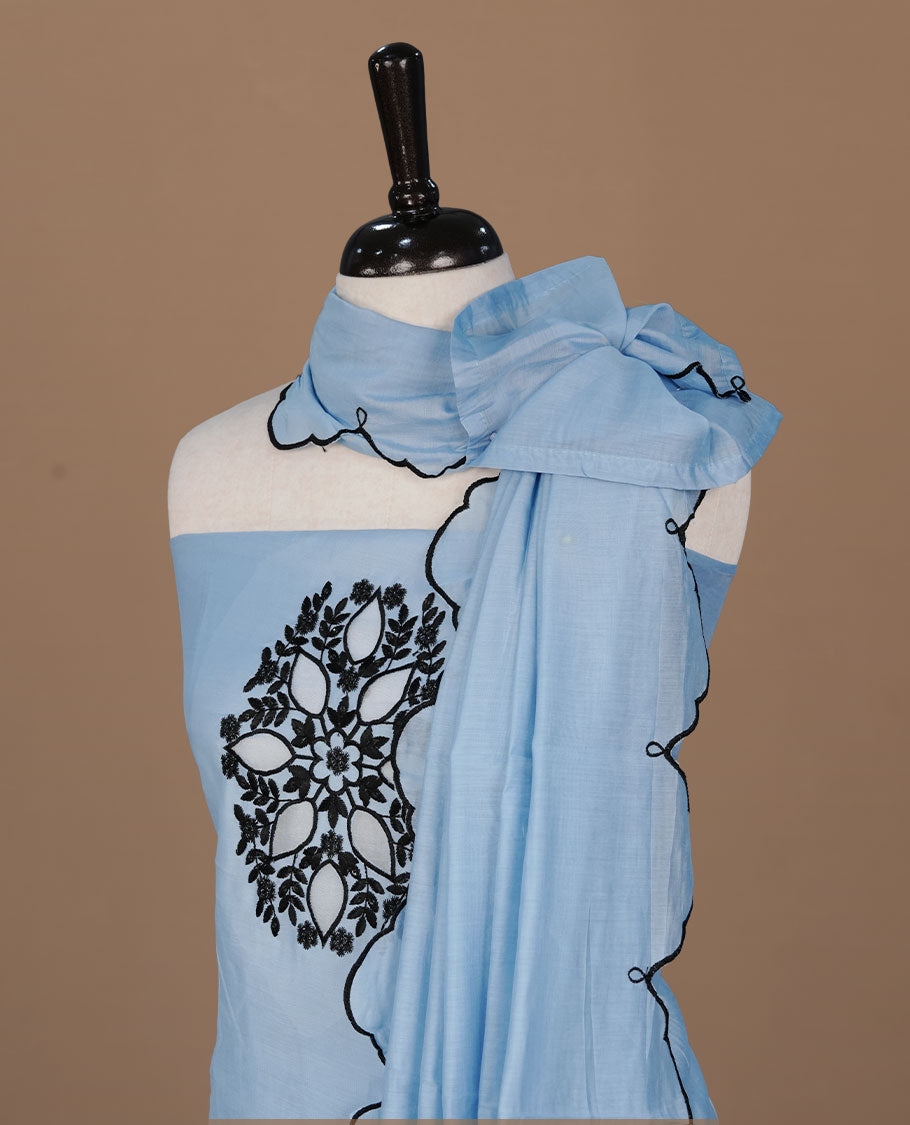Sky blue colour churidar material featuring black thread pattern on body, paired with matching bottom and dupatta.