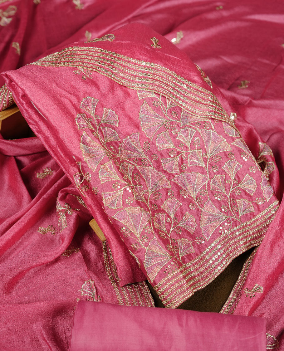 Pink colour churidar material with subtle mirror and thread embroidery, finished with delicate border detailing and paired with a matching plain bottom and dupatta.