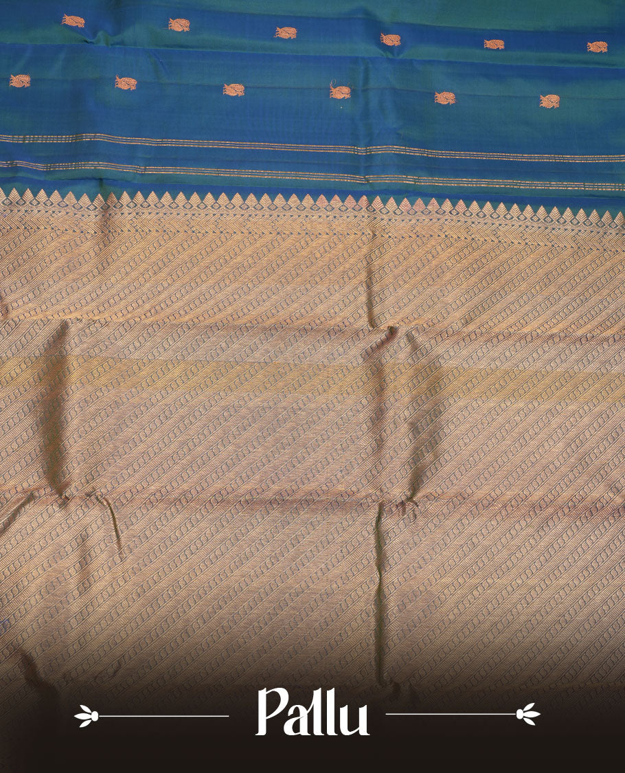 Peacock blue pure traditional Kancheepuram silk saree adorned with gold zari peacock motifs across the body, featuring elegant traditional borders with animal motifs, beautifully paired with a matching blouse piece.