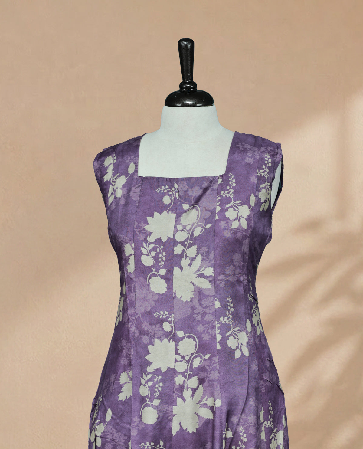 Purple Colour Kurti featuring Light Brown Colour Floral Prints on the body, a square neckline with a clean fitted yoke, sleeveless design