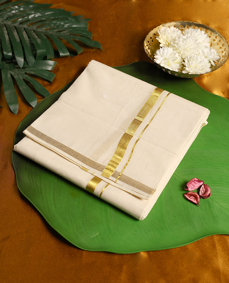 Classic ivory white pure cotton dhoti featuring a sleek golden zari border, crafted for effortless elegance, breathable comfort, and traditional style.