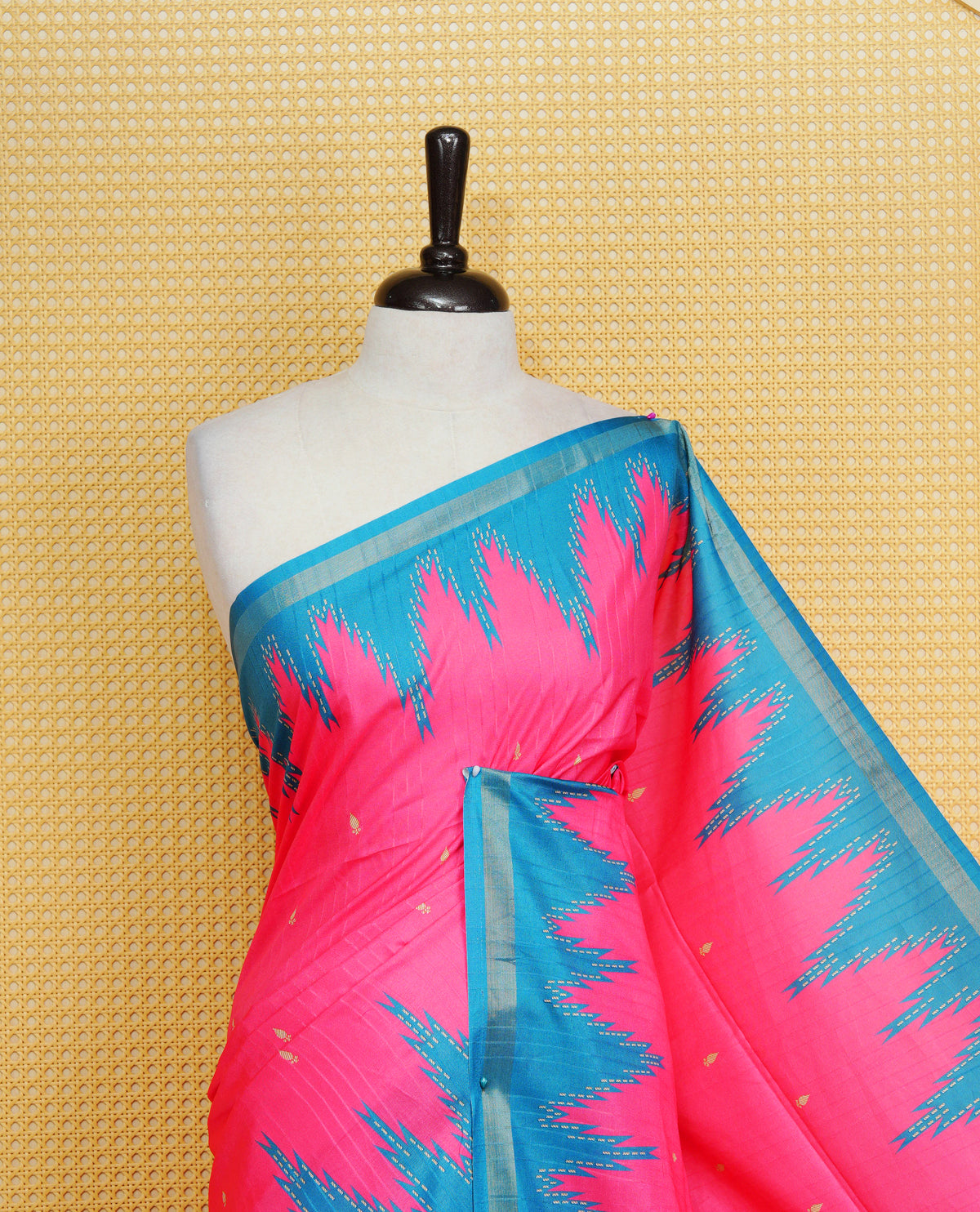Rose Berry and Peacock Colour Kattan silk saree featuring buttas all over the body, a temple-designed border & a contrasting striped pallu with tassels. Paired with a matching contrast-striped blouse piece.