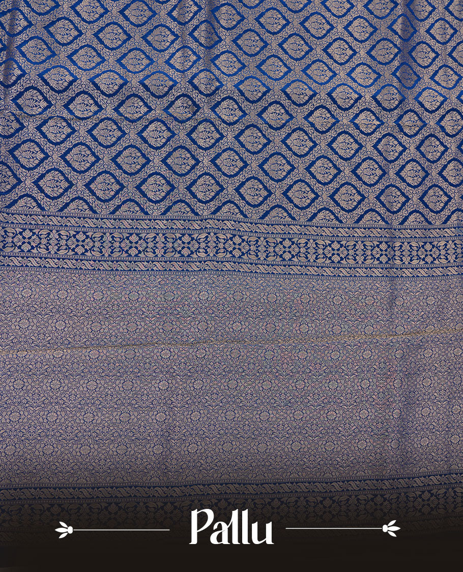 Dark blue colour banaras satin crepe saree featuring gold zari pattern across body, with self colour border with gold zari pattern and paired with matching blouse.