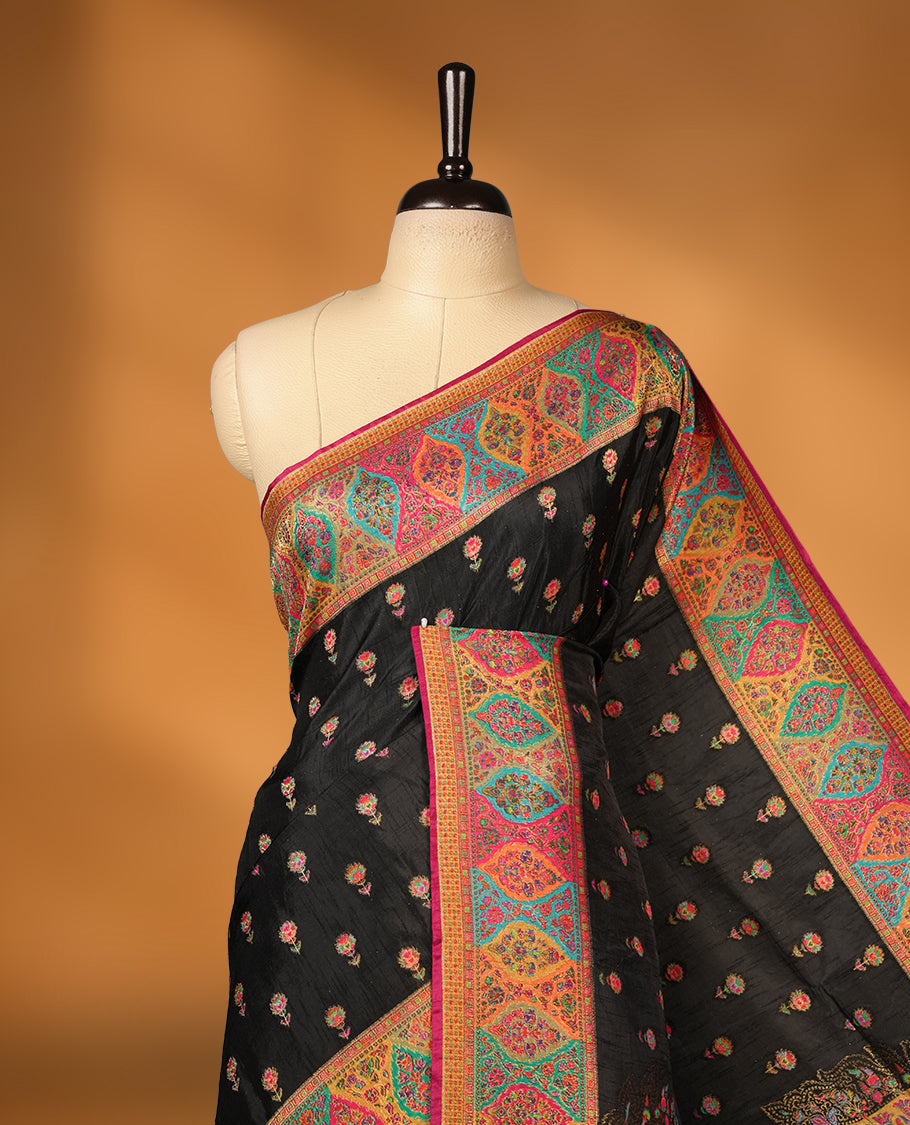 Black colour Pashmina silk saree densely woven with intricate multicolour floral motifs across the body, framed by an opulent arabesque border and grand storytelling pallu, paired with a matching woven border blouse piece