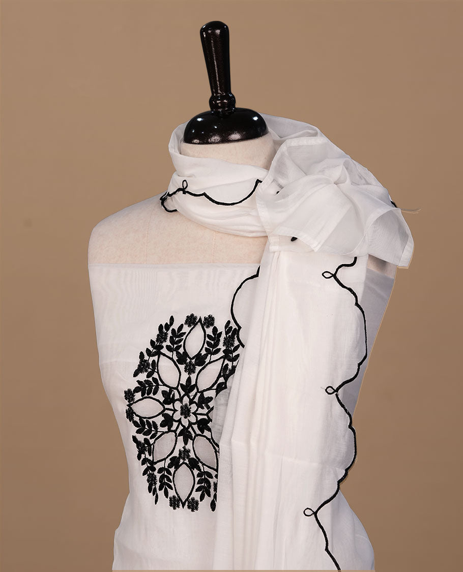 White colour churidari material featuring black thread pattern on body, paired with matching bottom and dupatta