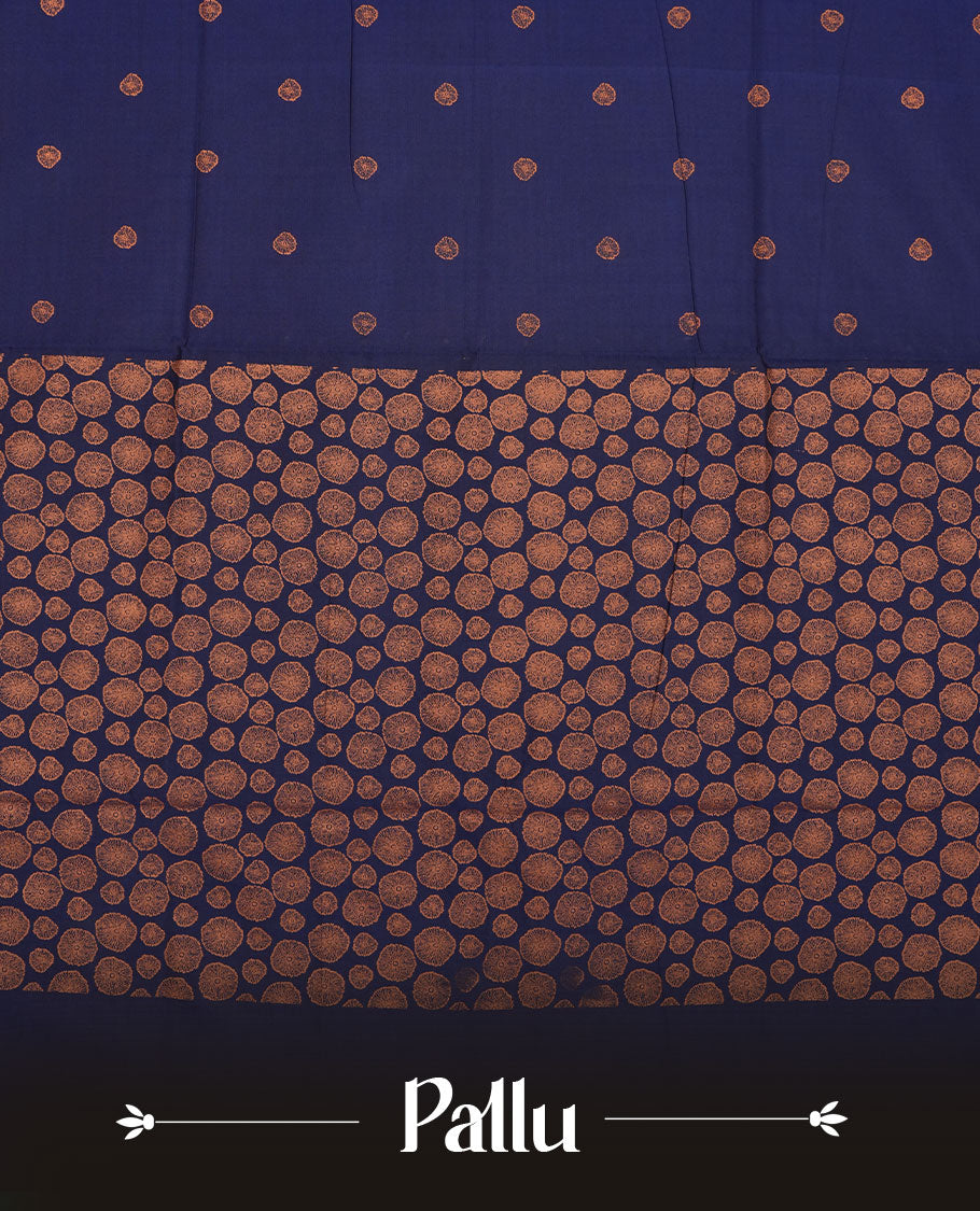 Navy blue colour poly cotton saree with orange abstract butti motifs on the body, paired with a matching pallu with dense orange textured round butta pattern, and a coordinated all‑over textured round butta printed blouse piece.