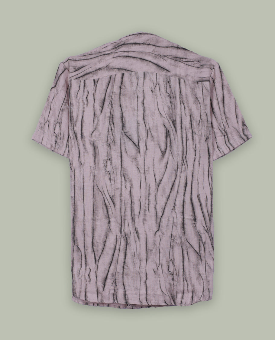 Light mauve short sleeve shirt featuring a unique crinkled black linear pattern, button down front, and classic collar & Crafted from breathable fabric, perfect for a casual yet stylish everyday look.