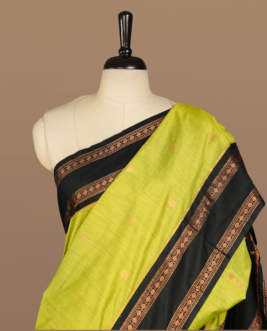 Lemon colour kalyani cotton saree featuring Elegant plain body, complemented by black colour with Antique zari border, paired with matching blouse piece.