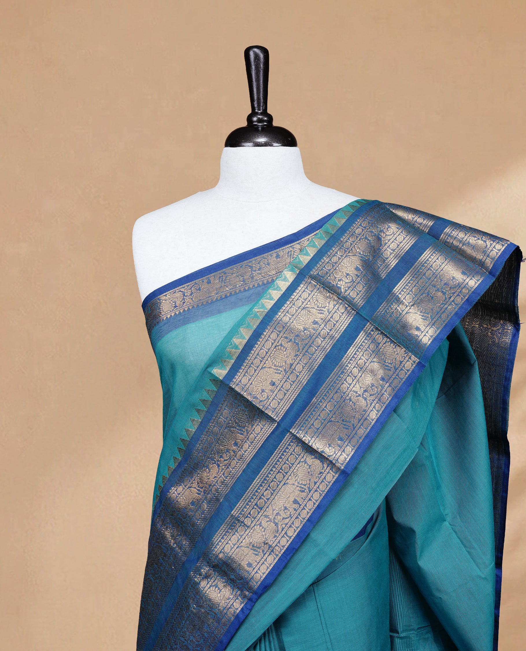 Aqua colour Chettinad cotton saree featuring Elegant plain body, complemented by contrast Teal colour with Gold zari border, paired with matching blouse piece.