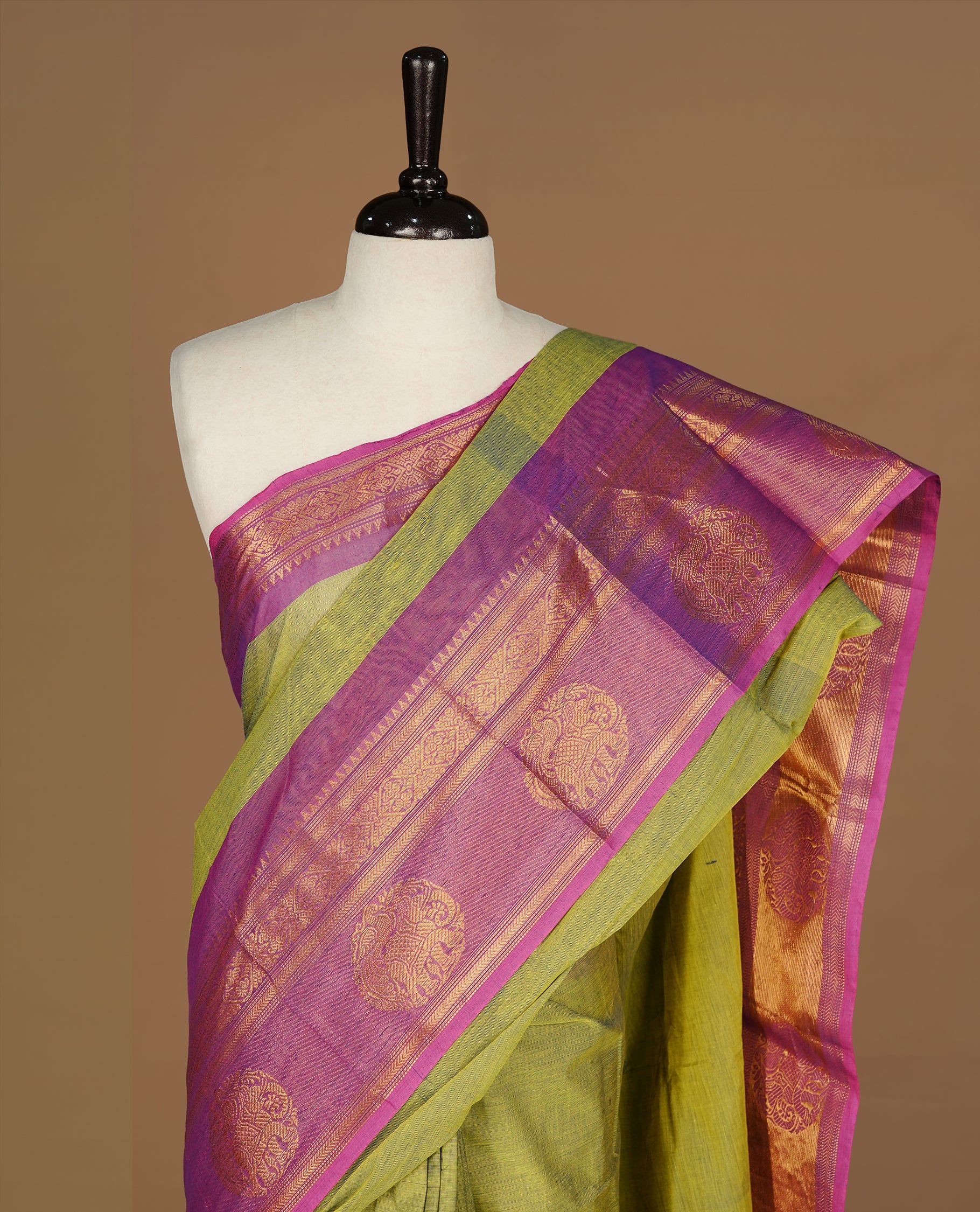 Olive Colour Chettinad cotton saree featuring elegant plain body , complemented by contrast Magenta colour with traditional border, comes with matching blouse piece.
