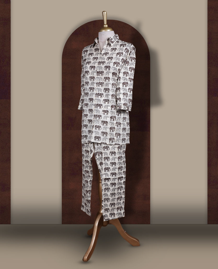 Off white colour cotton coord set featuring charming brown & grey colour elephant prints all over, Designed with a classic shirt collar and 3/4 sleeves, paired with matching straight pants for a trendy, relaxed, and comfy everyday look.