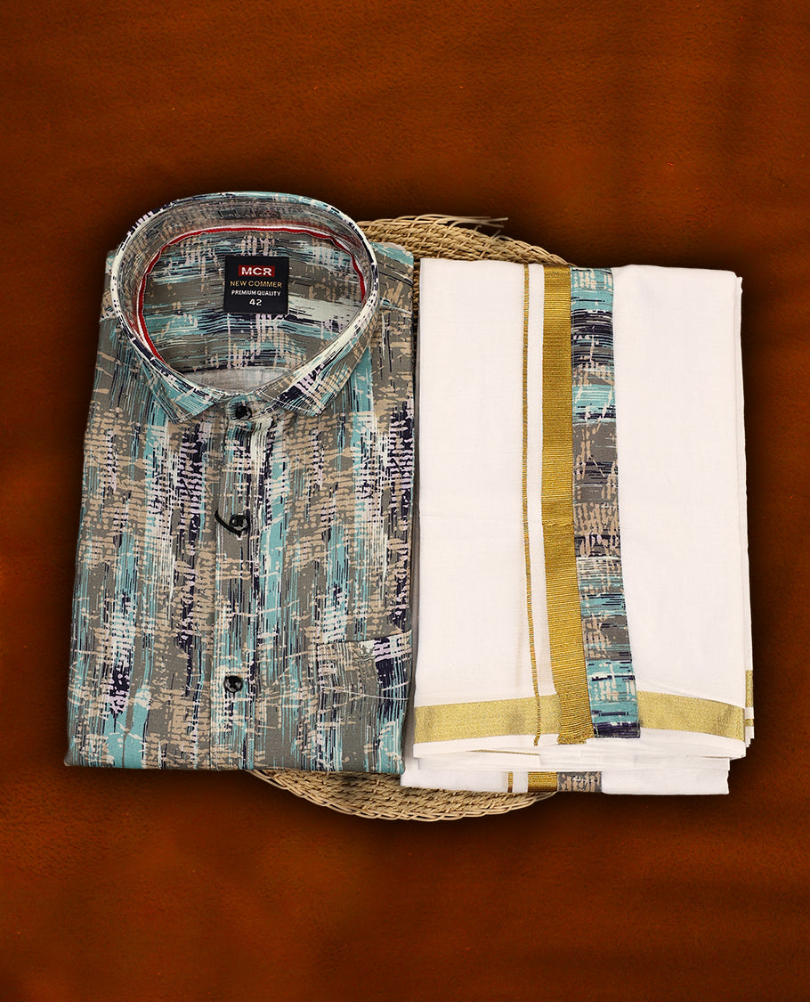 Multicolour abstract patterned MCR full sleeve shirt in shades of teal, grey, and navy, paired with a classic white dhoti featuring a rich golden zari kara and a matching multicolour printed border.