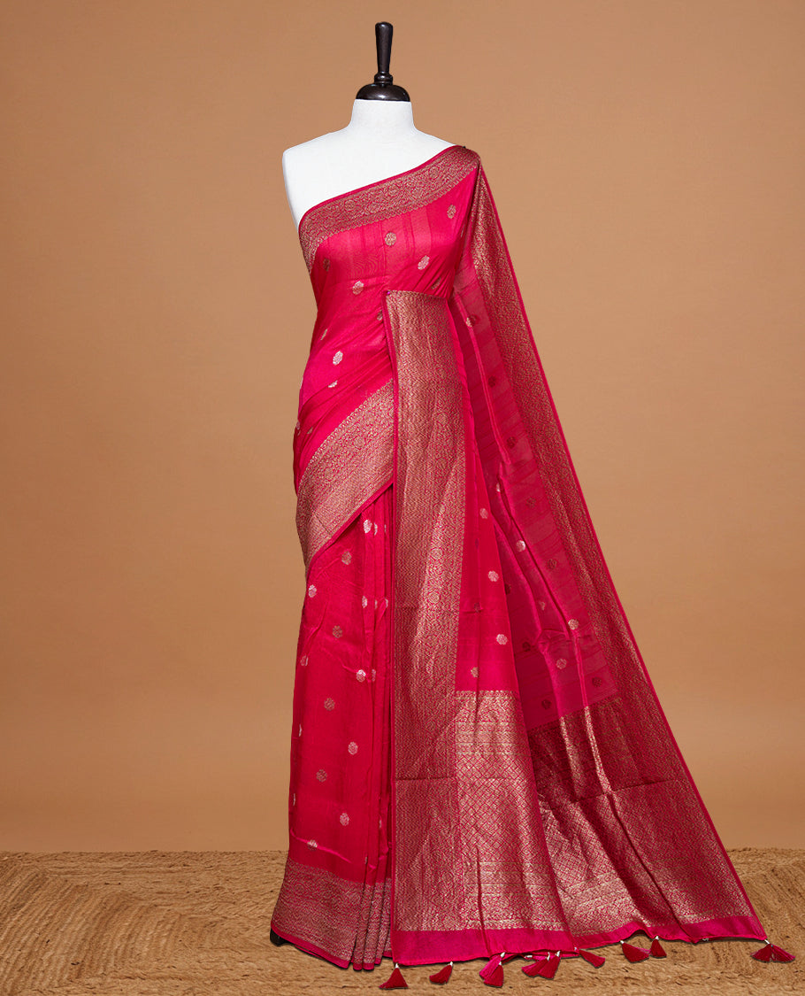 Magenta colour Semi banaras tussar georgette Saree featuring Antique zari motifs on body, enhanced with antique zari border, paired with a matching blouse piece.