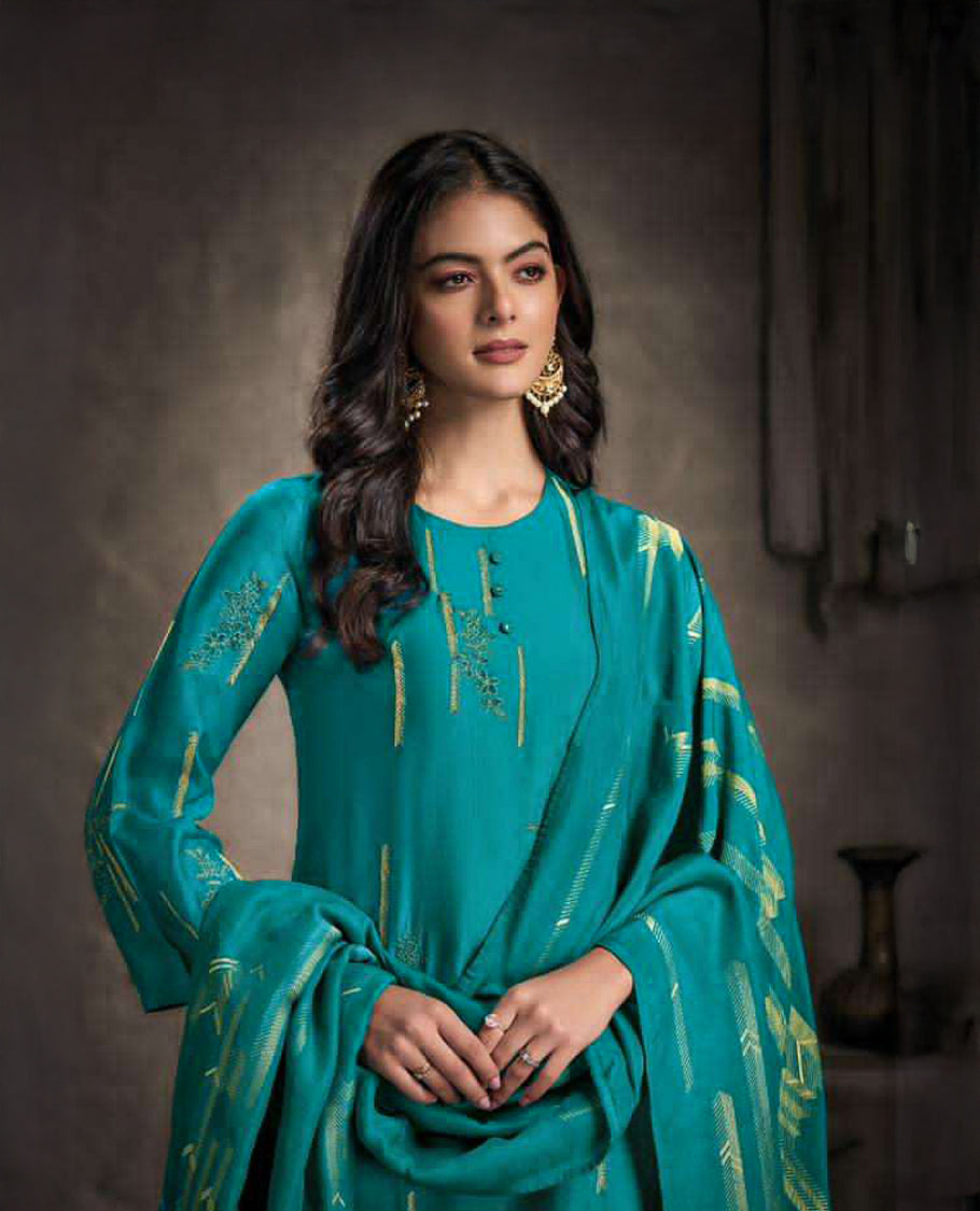 Pine green colour suit material with Rubina silk top adorned with elegant embroidery work, paired with luxurious satin bottoms, and completed with a muslin jacquard dupatta featuring rich woven detailing