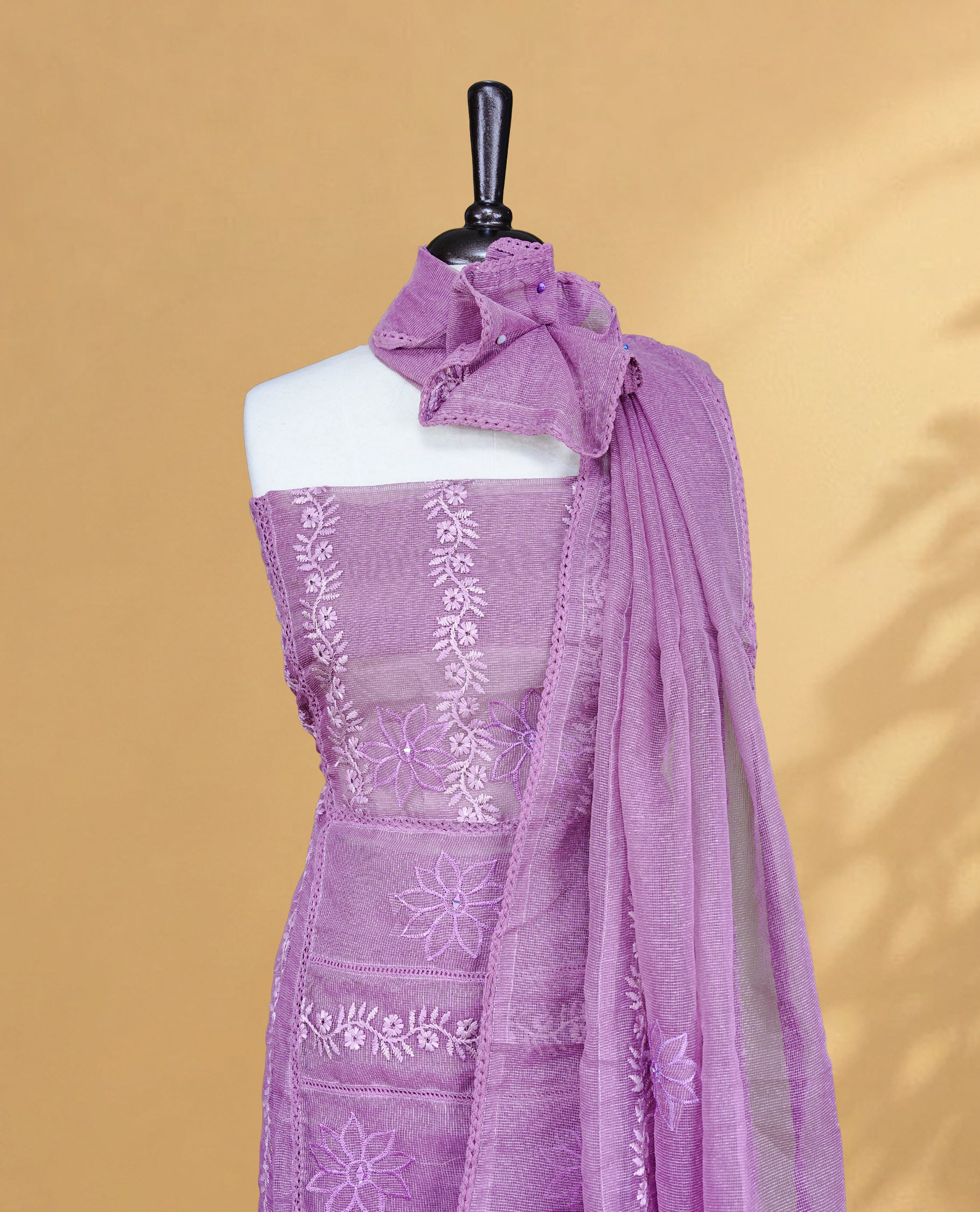Purple colour Salwar material featuring Self colour Floral Thread pattern, Matching bottom and paired with Same colour with thread patterned Dupatta.