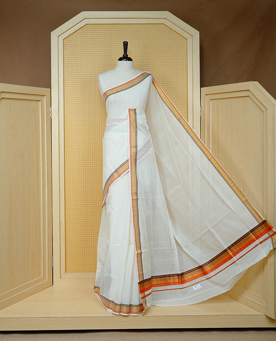 Cream colour Cotton kerala saree featuring Classy Plain body, complemented by Gold with Brown & Orange zari border & Pallu, paired with matching blouse piece.
