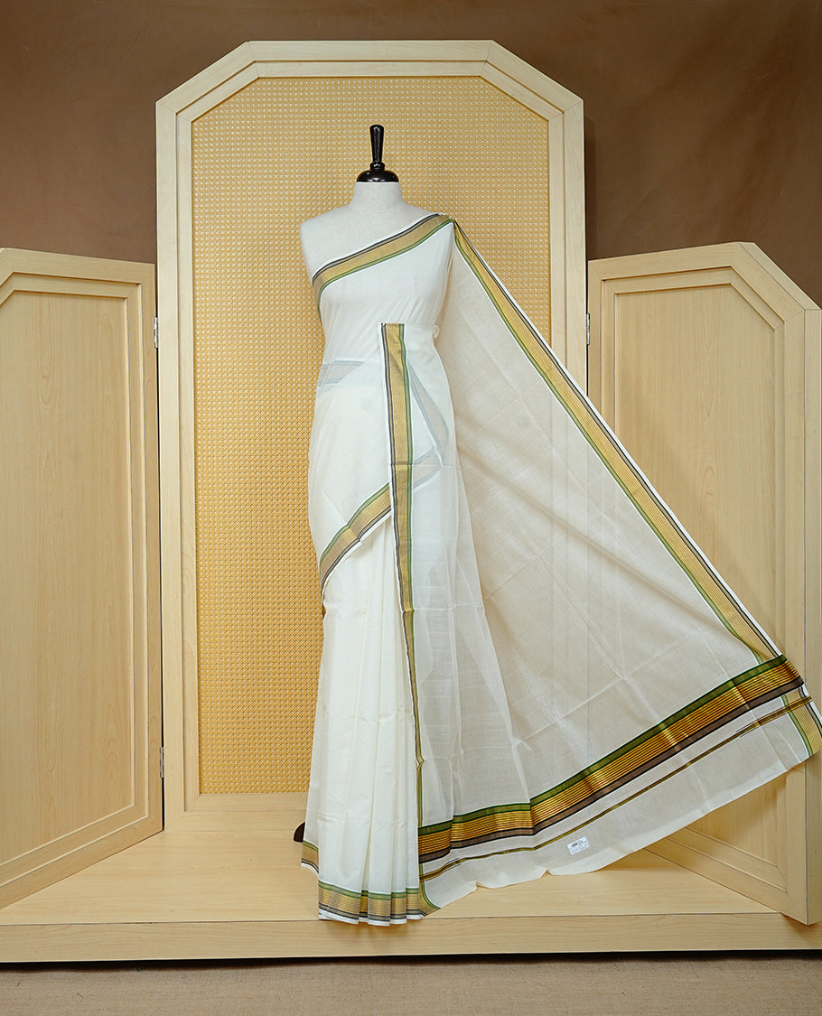 Cream colour Cotton kerala saree featuring Classy Plain body, complemented by Gold with Green & Black zari border & Pallu, paired with matching blouse piece.
