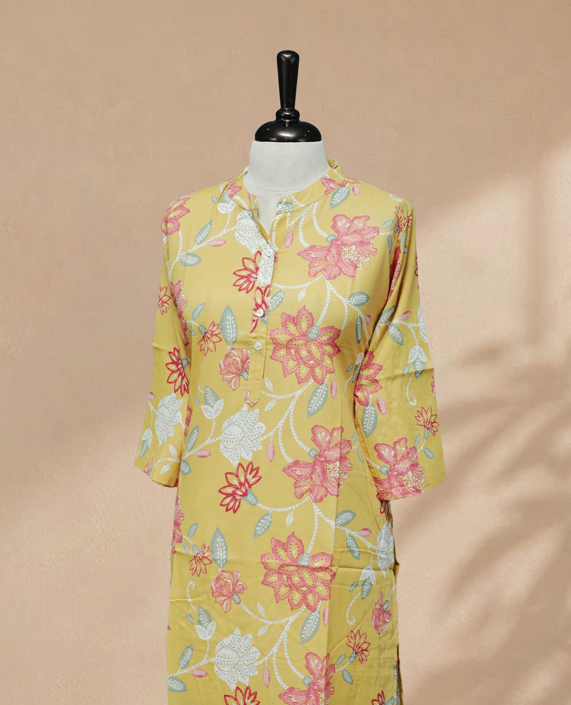 Light Yellow colour kurti featuring classic U-Shaped neckline, Digital floral print on body, with sleeve.