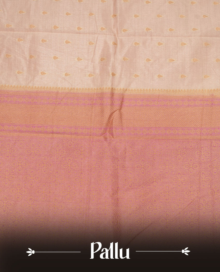 White gold colour semi tussar saree featuring Gold zari buttas body, contrast Pink colour gold zari border and comes with matching blouse piece.