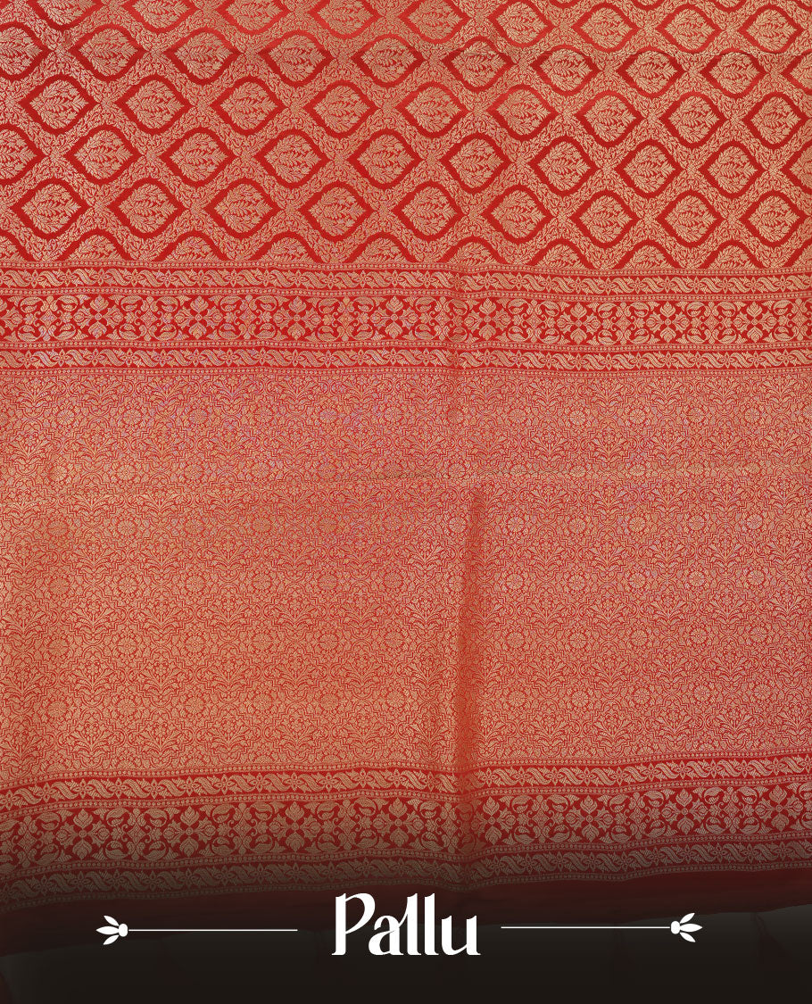 Red colour banaras satin crepe saree featuring gold zari pattern across body, with self colour border with gold zari pattern and paired with matching blouse.