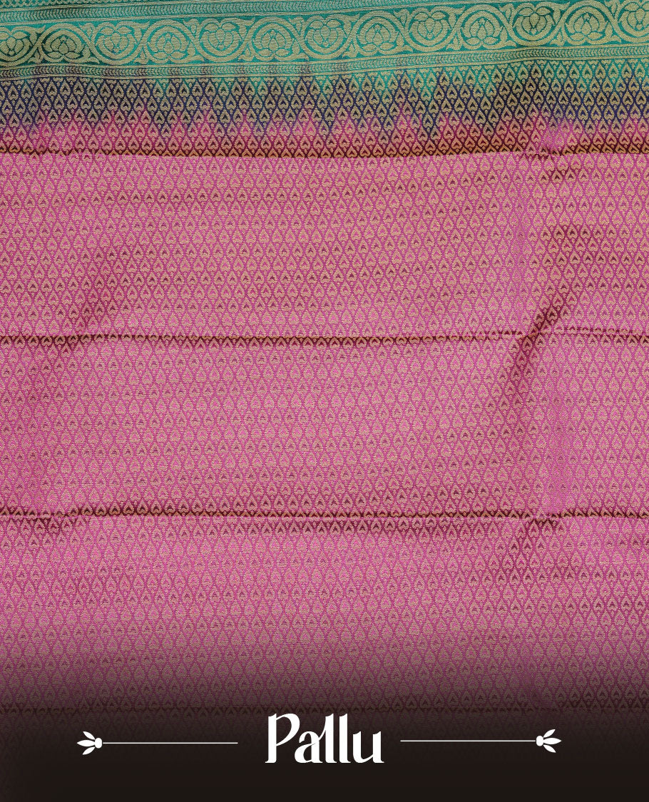 Teal colour soft silk saree featuring Gold zari motifs on body, complemented by contrast Magenta colour with traditional border, paired with matching blouse piece.