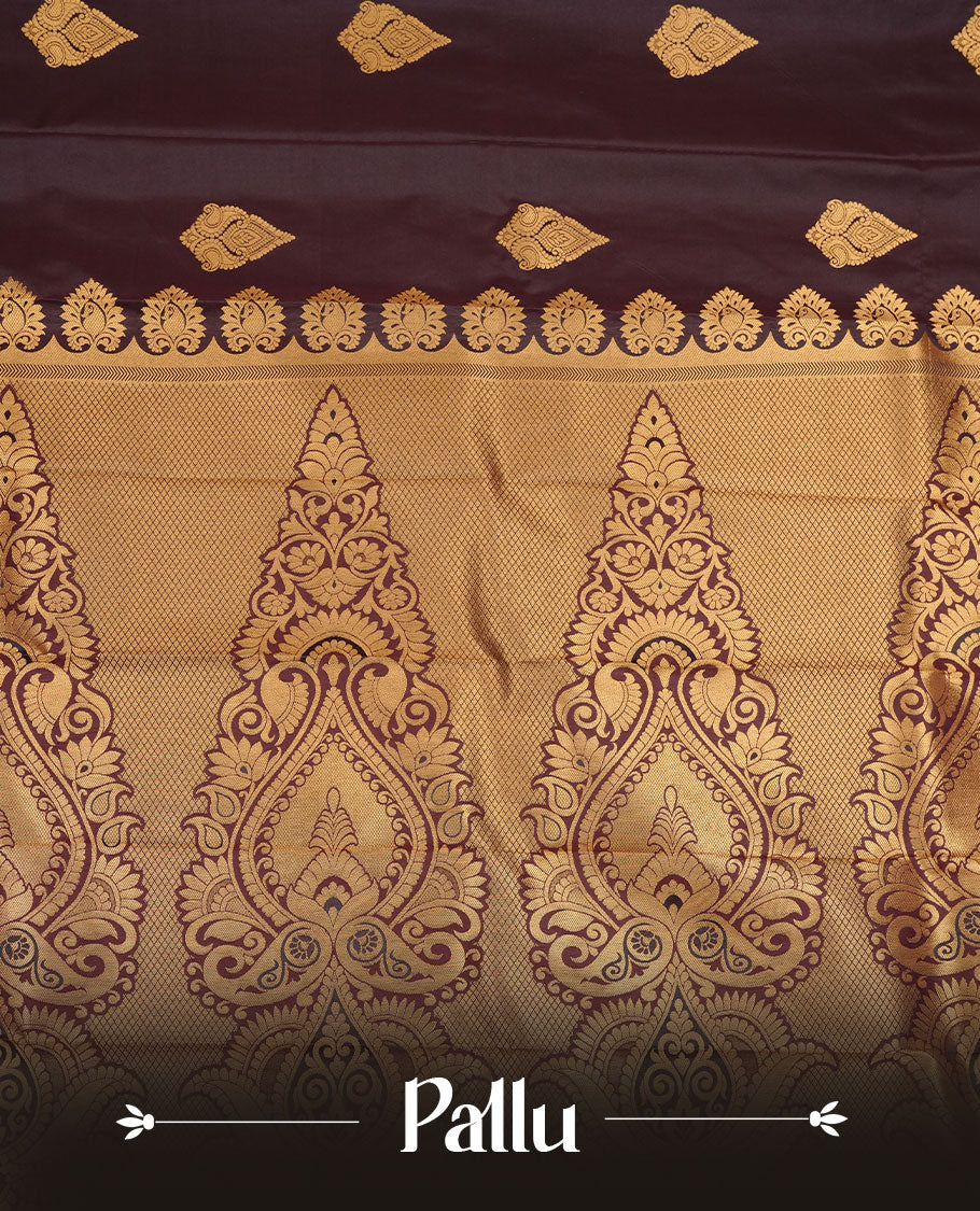 Chocolate colour soft silk saree featuring Gold zari motifs on body, complemented by self colour with traditional border, paired with matching blouse piece.